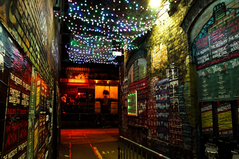 string, light, lanes, building exterior, electricity, store, atmosphere, holiday, bottle, black, city, bricks, hallway, night, lights, wall - building feature