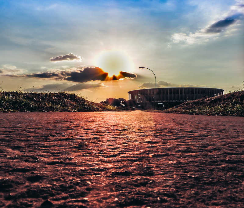 architecture, surface level, cloud - sky, water, brasilia, outdoors, brazil, city, orange color, sunlight, 2K, sunbeam, beauty in nature, sun, sky, no people