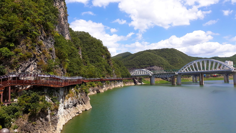 outdoors, beauty in nature, built structure, landscape, bridge - man made structure, cloud - sky, architecture, cliff, connection, transportation, no people