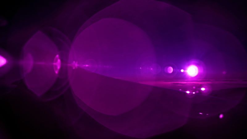 arts culture and entertainment, aircraft, reflection, close-up, shape, pink color, light - natural phenomenon, dark, violet, night, glowing, radius, sun