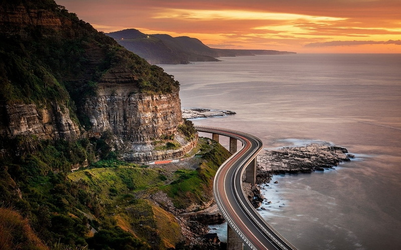 clouds, highway, cliff, landscape, 480P, mountains, nature, shrubs, sea, coast, sunset