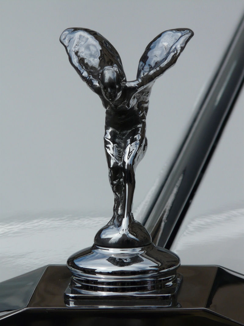statue, chrome, gray, 2K, indoors, cool figure, no people, wall - building feature, shape, silver colored, still life, rolls royce, spirit of ecstasy