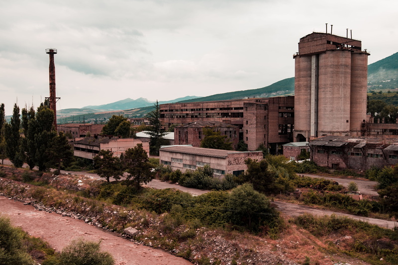 building exterior, tree, nature, sky, mountain, no people, 4K, outdoors, tower, smoke stack, travel destinations, production, georgia, plant, jairph, old factory