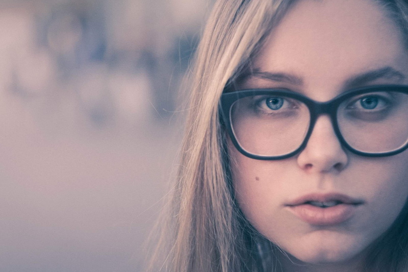 hairstyle, girl, females, hair, glasses, one person, women, contemplation, close-up, portrait, pastel, face, adult, blonde, human body part, looking at camera