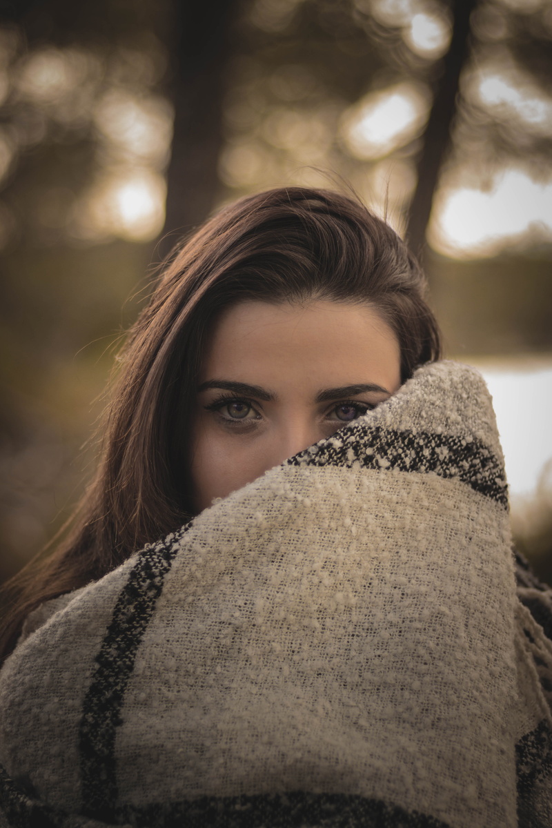 hairstyle, looking at camera, young adult, leisure activity, front view, brown, girl, female, covering, obscured face, one person, blanket, beauty, real people