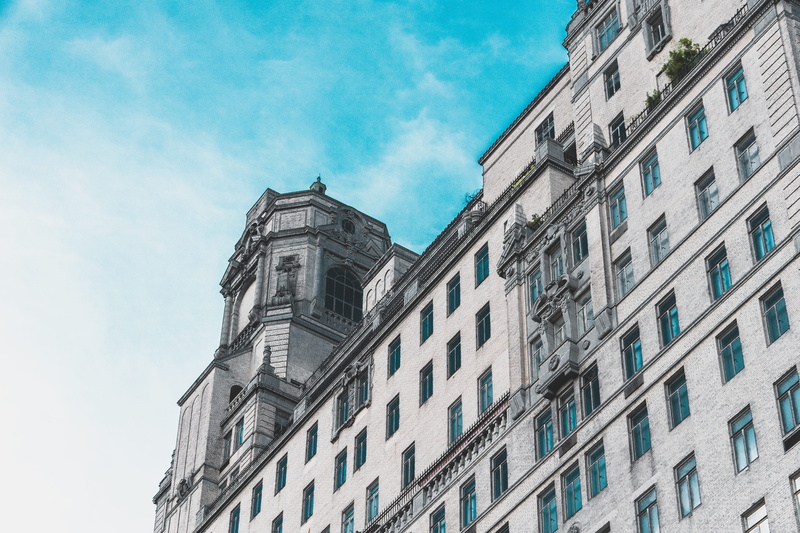 low angle view, built structure, windows, cloud - sky, city, building exterior, nature, wall, blue sky, travel, building, outdoors, the past, day, 5K