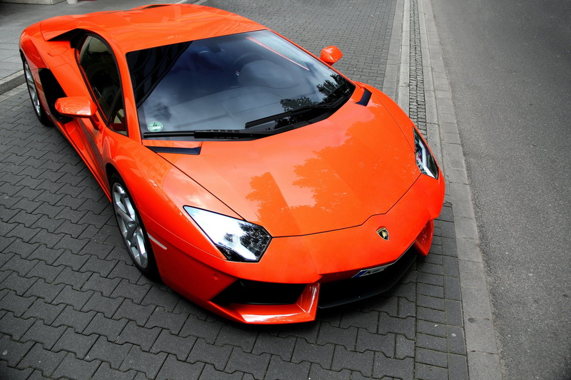 land Vehicle, germany, urban Scene, city, supercar, engine, outdoors, motor vehicle, aventador, modern, editorial, coupe, no People, parking, car, orange color