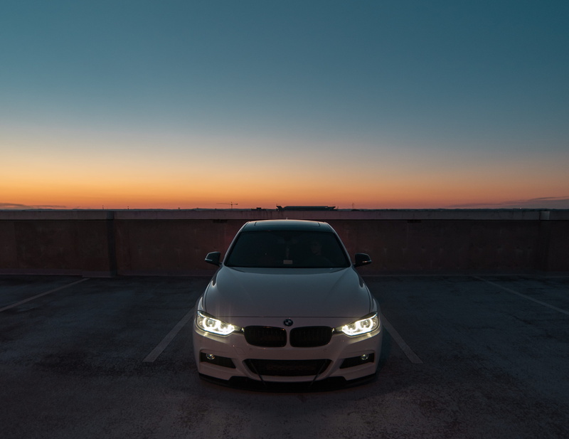 near, copy space, illuminated, land vehicle, nature, parked, transportation, wall, clear sky, airport runway, car park, car, orange color, 3 series, airport