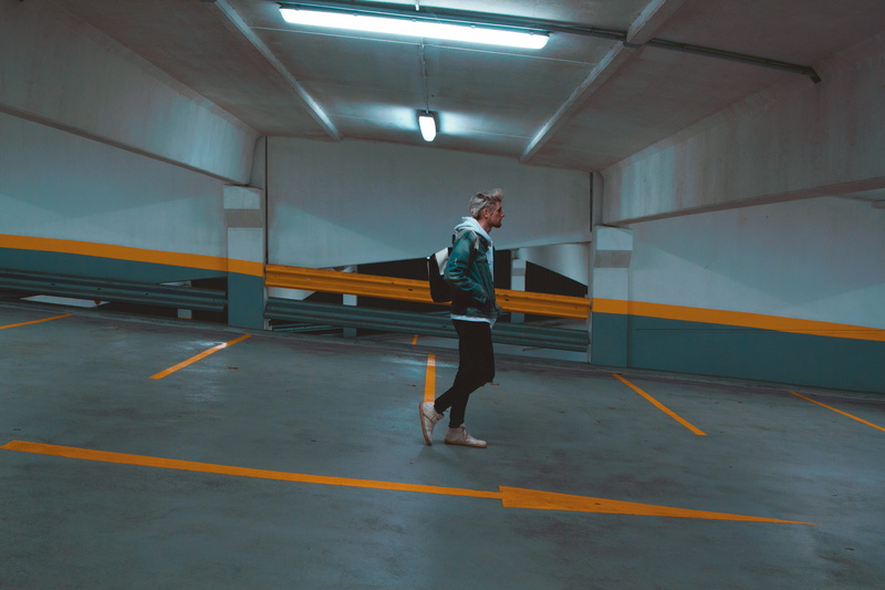 men, building, parking, 5K, hoodie, underground, one person, side view, motion, parking garage, architecture, illuminated, casual clothing, black, transportation