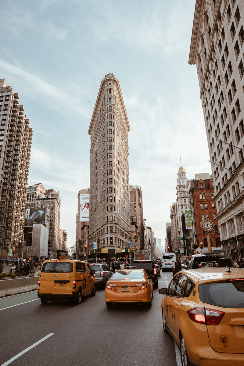 color, urban, city street, office building exterior, mode of transportation, cloud - sky, vehicle, tall - high, flat, building, city, metropolis, flatiron building