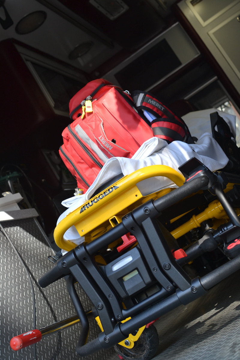 land vehicle, indoors, sport, medic, professional sport, stationary, mode of transportation, no people, hospital, red, ems, sports equipment, medical, day