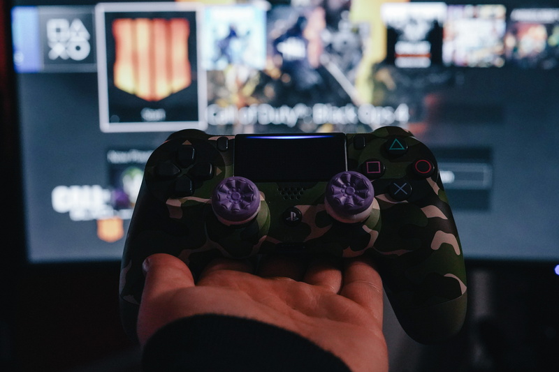 photo, person, indoors, technology, arcade game machine, device screen, holding, video camera, human, communication, personal perspective, close-up, electronics