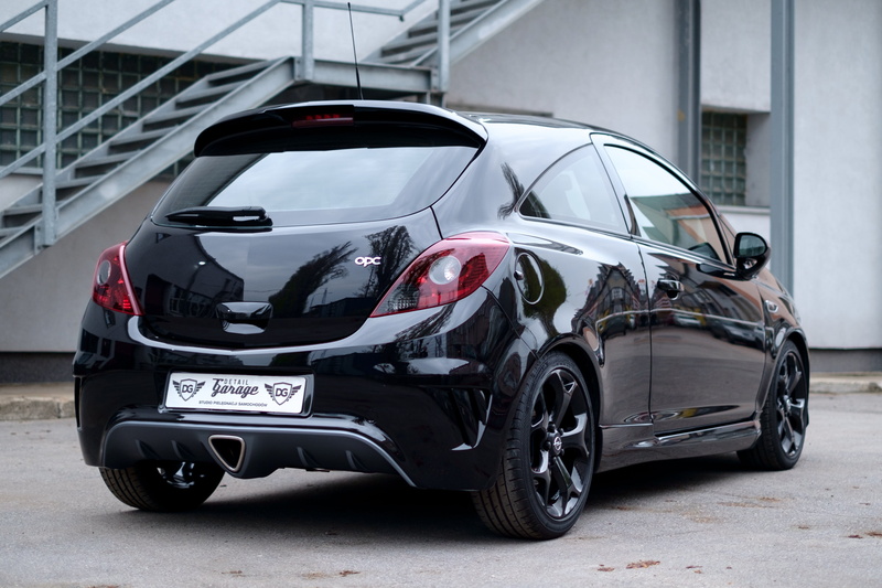 parking, outdoors, safety, day, sport, black color, no people, stationary, parking lot, auto, vechicle, limited, vehicle, car, business, modern, opel, building exterior