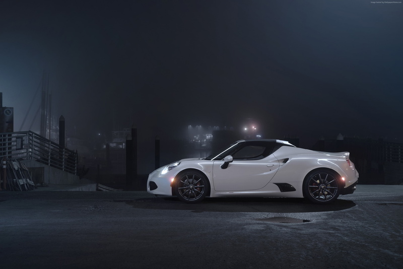city, building exterior, copy space, car, outdoors, garage, coupe, sportcar, stationary, luxury, illuminated, white., no people, land vehicle, transportation