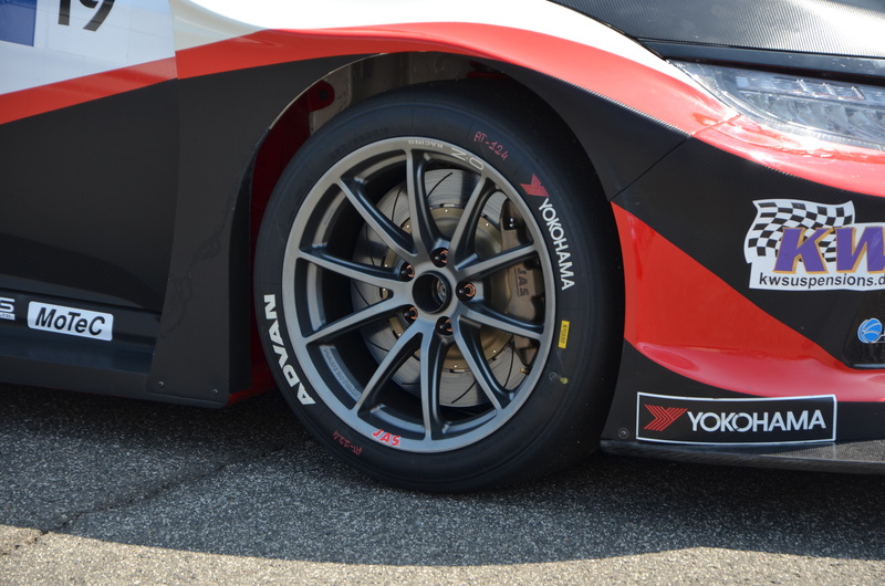 outdoors, day, street, tire, motor vehicle, wheels, no people, spoke, 4K, red, city, text, tyres, sign, car, land vehicle, wheel, luxury, road, vehicle part