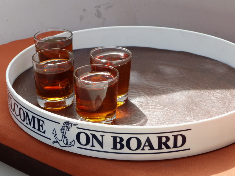 freshness, drink, tray, glass - material, drinking glass, high angle view, tea, alcohol, liqueur, plate, western script, still life, food and drink, brandy