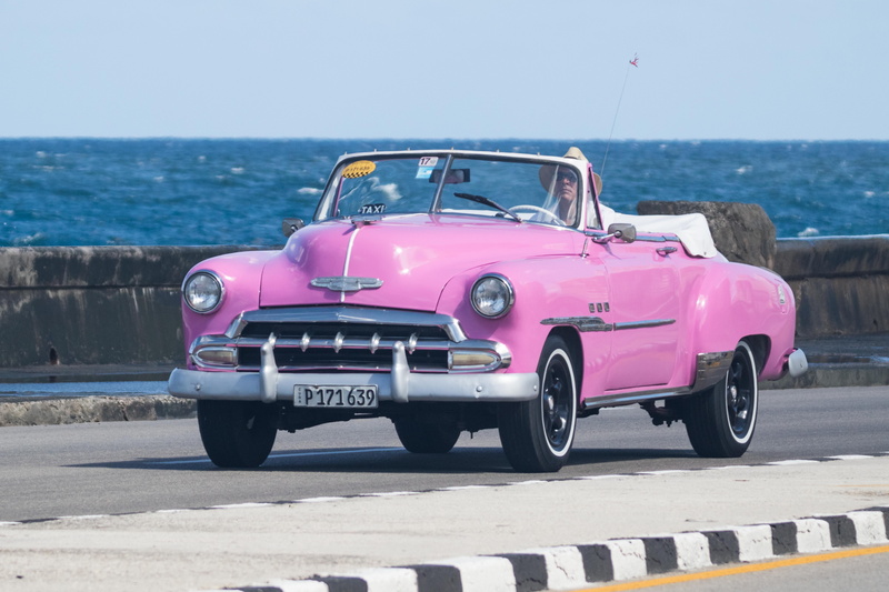pink color, havana, water, taxi, clear sky, horizon, stationary, sea, sunlight, mode of transportation, retro styled, no people, horizon over water, classic