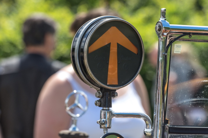 incidental people, men, auto, oldtimer, motorcycle, day, street, close-up, outdoors, land vehicle, music, arrow, transportation, real people, metal, automotive