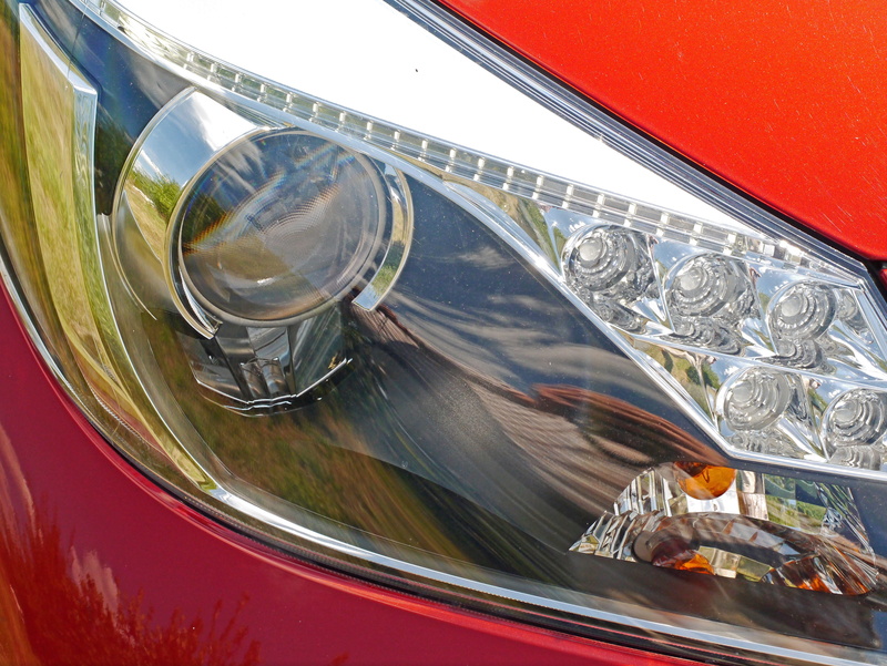 headlight unit, glass, transparent, headlights, light bulb, no people, drink, outdoors, window, metal, day, auto, mode of transportation, silver colored