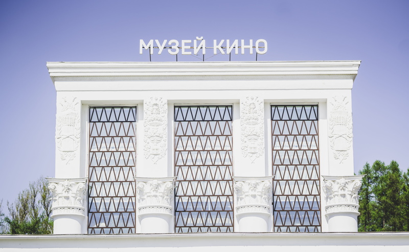 office building, symmetry, cinema, door, white, housing, day, no people, facade, text, low angle view, picture window, architecture, 5K, building, window