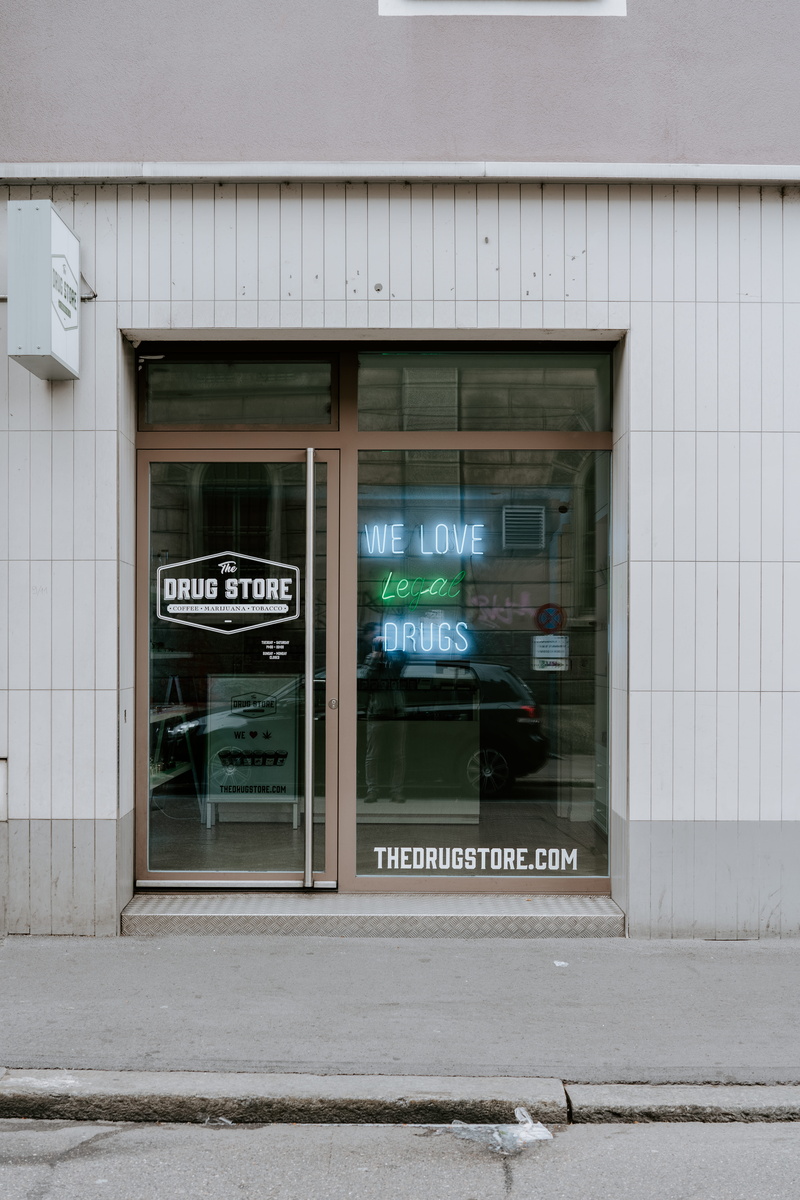 vehicle, shop, road, day, information sign, automobile, text, building exterior, zurich, path, garage, transportation, zürich, cafeteria, home decor, city