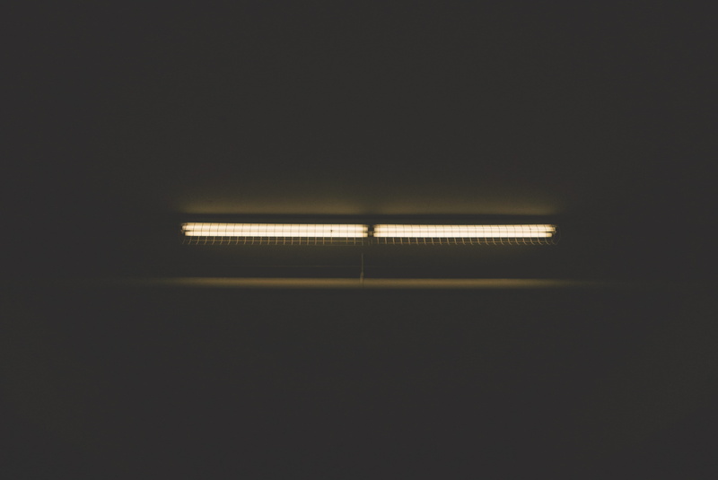 electric lamp, technology, indoors, parking structure, lighting equipment, lights, cages, flourescent, glowing, night, dark, low angle view, copy space