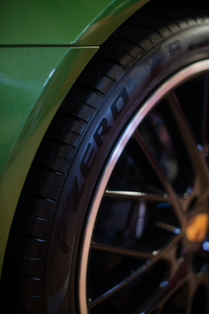 5K, stationary, vehicle part, car wheel, speed, alloy wheel, focus on foreground, rubber, selective focus, outdoors, hubcap, machine, wheel, bracket, halter