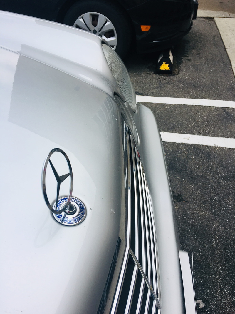 road, mirror, wheel, high angle view, car, windshield, silver colored, sign, staircase, headlight, trademark, outdoors, metal, transportation, city, day