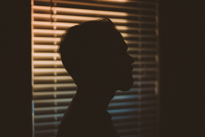 young adult, real people, blur, shutter, dark, one person, 5K, headshot, indoors, close-up, window, side view, portrait, brick wall, wall, white, brick