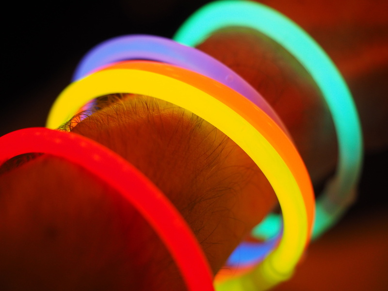 glow stick, focus on foreground, colorful, bracelet, selective focus, bracelets, studio shot, yellow, celebration, indoors, vibrant color, arm, bangle