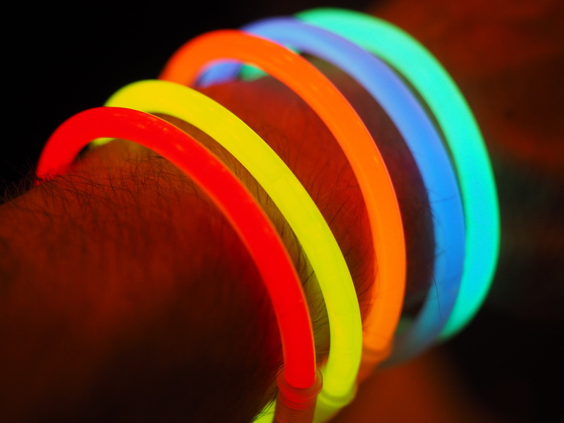 spiral, colorful, indoors, arm, extreme close-up, group of objects, bangle, multi Colored, light, ball, glow stick, bracelets, large group of objects, no people