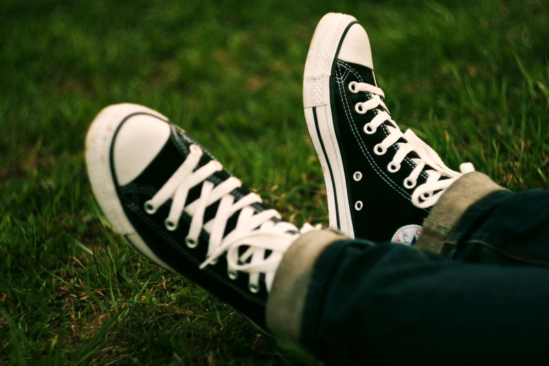 low section, field, pair, Grass, black, shoes, Fashion, body part, Sneakers, canvas shoe, human foot, star, one person, shoe, day, lifestyles, human body part