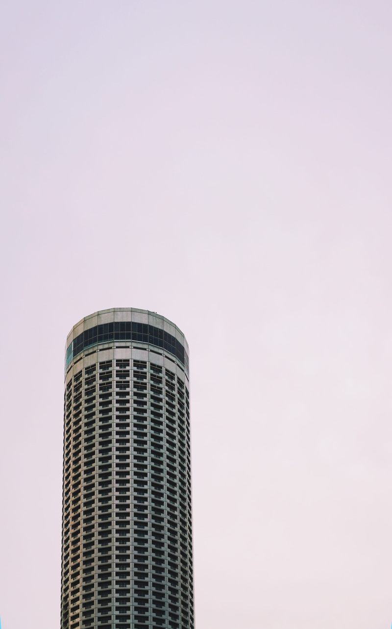 skyscraper, architecture, sky, building, outdoors, tall, built structure, building exterior, clear sky, modern, tall - high, minimal, day, office building exterior