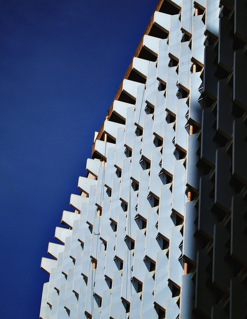 design, low angle view, nairobi, skyscrapper, outdoors, pattern, built structure, city, no people, blues, sky, in a row, architectural feature, repetition