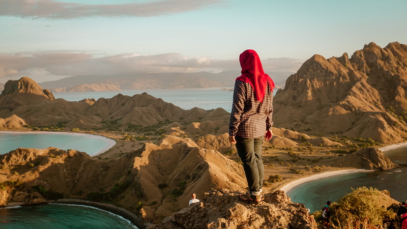 water, rock, tranquil scene, looking at view, top, lake, sea, beauty in nature, padar island, scenics - nature, human, rock formation, surrounded, women