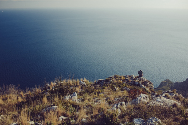 non-urban scene, near, rock - object, scenics, person, nature, cliff, solid, brown, water, high angle view, scenics - nature, no People, plant, gray, tranquil scene