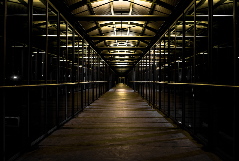 person, light - natural phenomenon, absence, 5K, built structure, symmetry, shape, the way forward, glass, arcade, building, footpath, ceiling, indoors