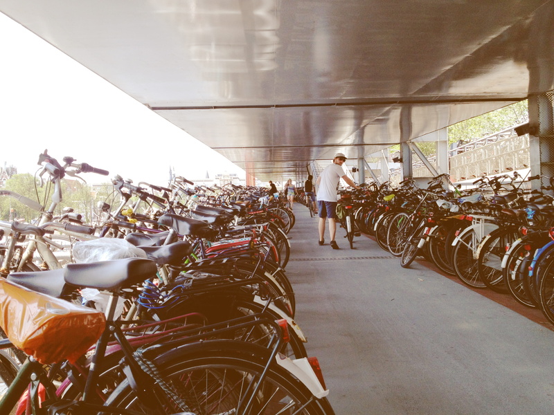 group of people, amsterdam, mode of transportation, people, parkade, architecture, busy, parking, real people, day, lifestyles, bicycle, women, netherlands
