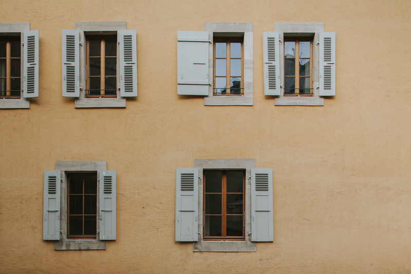 residential district, no people, opened, architecture, side by side, low angle view, day, building exterior, safety, outdoors, concrete, reflection, windowpanes