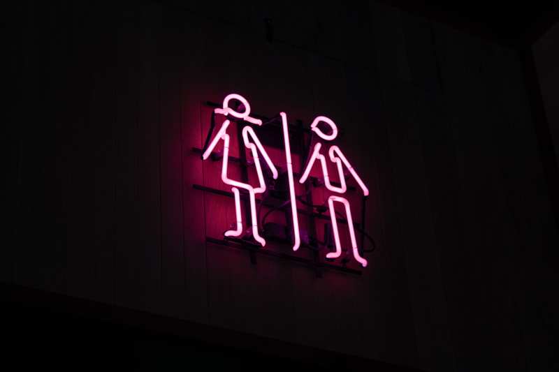 neon, commercial sign, 5K, woman, information, business, information sign, communication, architecture, pink, single word, black background, sign, western script