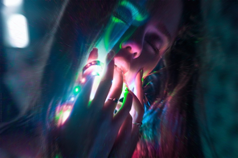 illuminated, laser, neon, brown hair, beautiful woman, futuristic, women, adult, glowing, technology, one person, indoors, multi colored, close-up, looking