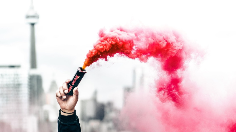 males, hand, architecture, smoke bomb, communication, red, red smoke, holding, 1080P, human hand, building exterior, day, men, built structure, mid adult