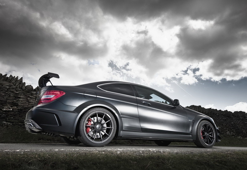 motor vehicle, black color, sports car, transportation, day, mercedes-benz, cloud - sky, land vehicle, c63, silver colored, overcast, no people, nature