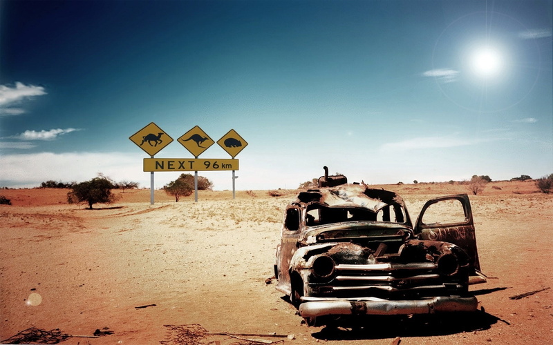 cloud - sky, land vehicle, day, sign, nature, landscape, sky, rust, junkyard, land, arid climate, car, dirt, desert, road, outdoors, no people, built structure