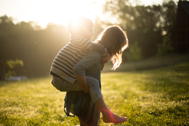 playing, standing, carrying, goldenhour, grass, kid, s, togetherness, daughter, adult, sibling, lifestyles, back, sunlight, lens flare, positive emotion