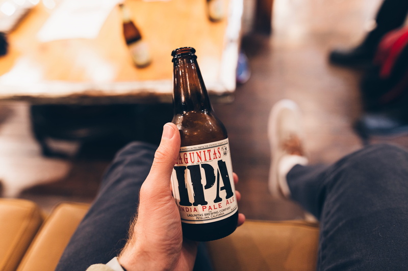 container, lifestyle, one person, food and drink, beer, san francisco, hand, wine bottle, brew, beer - alcohol, beer bottle, human hand, glass, celebration