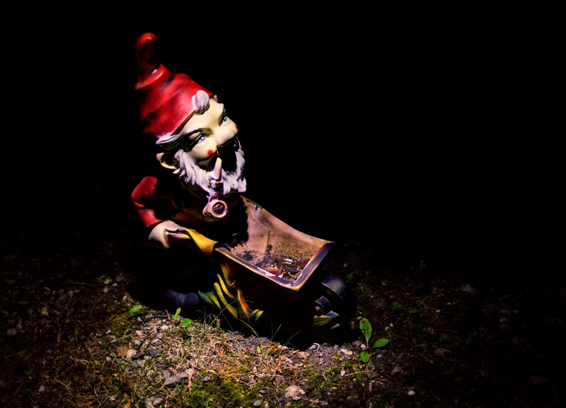 toy, black background, dark, gnome, dwarf, representation, illuminated, land, outdoors, grass, mode of transportation, transportation, people, 4K, plant
