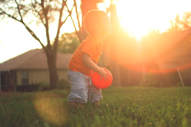 play, casual clothing, real people, fun, men, outdoors, nature, Good Vibes, kid, orange, full length, lens flare, innocence, children only, boys, sport