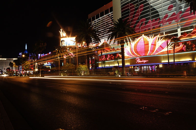 skyscraper, motion, transportation, light trail, signs, building exterior, built structure, speed, outdoors, sky, long exposure, illuminated, road, Las Vegas