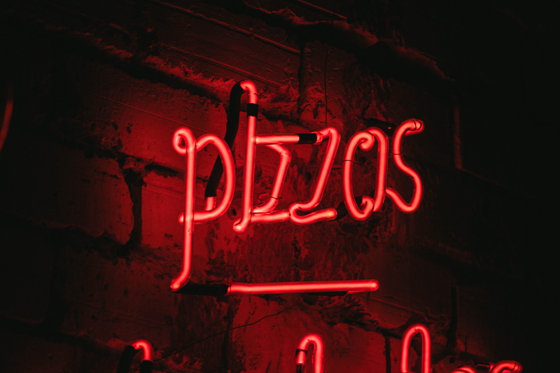 letter, dark, western script, neon, red neon, lighting equipment, communication, brick, signage, orthographic symbol, light - natural phenomenon, single word